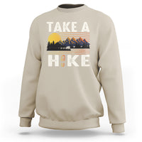 Sand beige hiking sweatshirt with “Take a Hike” front graphic and mountain scene
