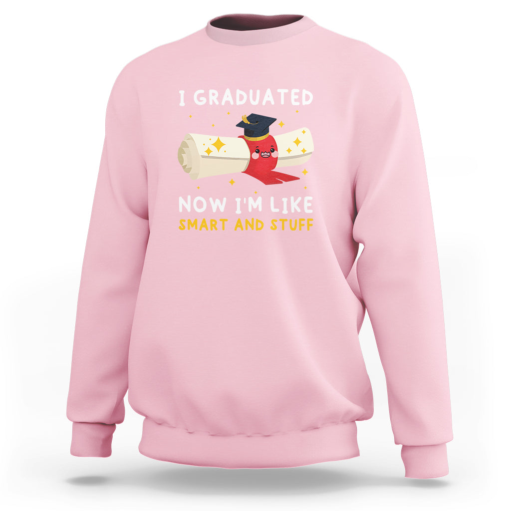 Light pink graduation sweatshirt with crew neck and 'I graduated now I'm like smart and stuff' print