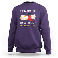 Purple graduation sweatshirt with crew neck and graduation quote 'I graduated now I'm like smart and stuff'