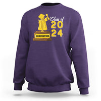 Purple graduation sweatshirt with “Class of 2024” graphic and cap-and-gown emblem