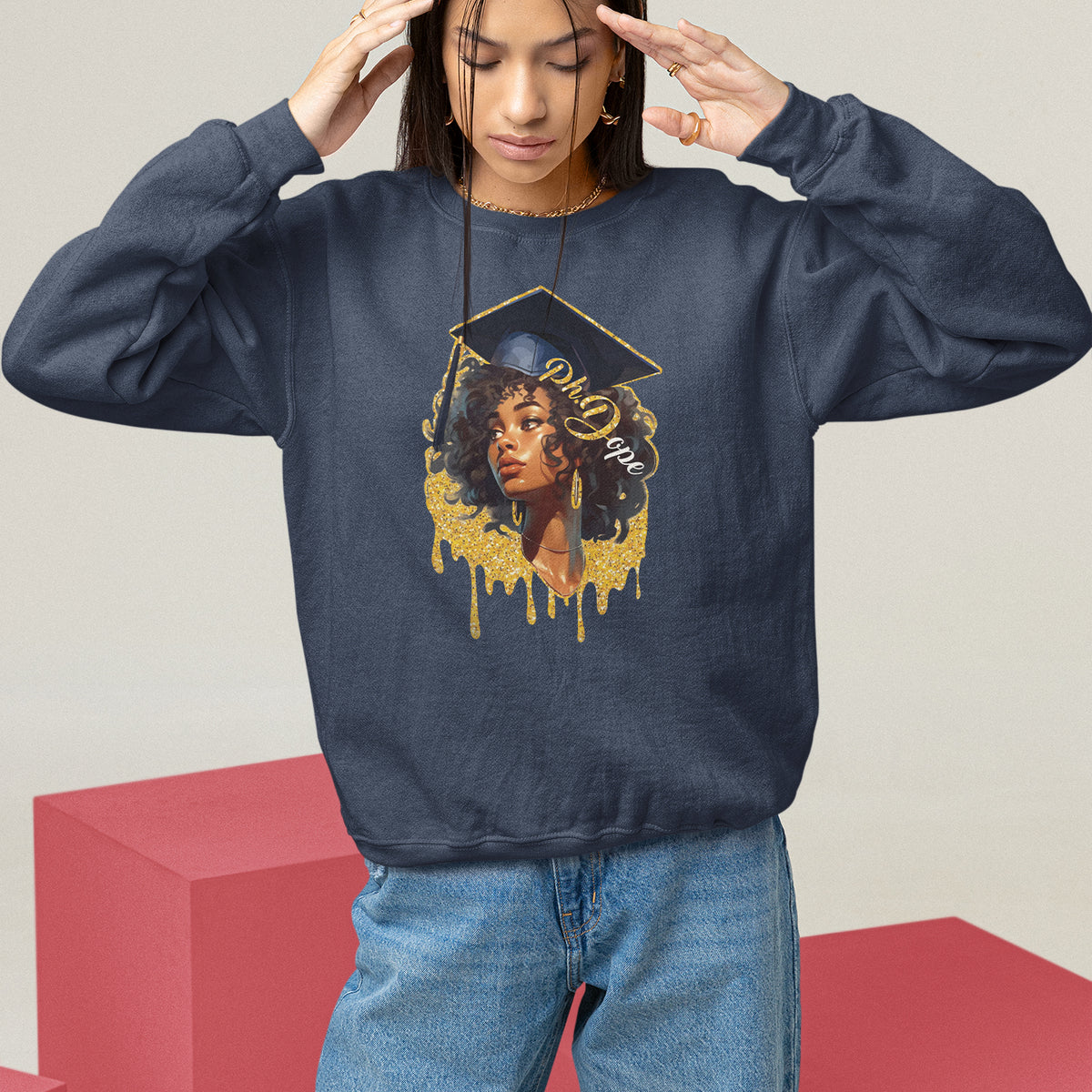 Dark crewneck sweatshirt with front doctorate cap graphic and dripped text