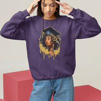 Purple crewneck sweatshirt with front doctorate cap graphic and dripped text