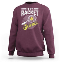 Maroon sweatshirt with tennis racket science graphic and ribbed cuffs.