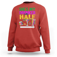 Red crewneck sweatshirt with “She’s My Drunker Half” Mardi Gras graphic on front.