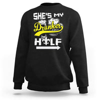 Black sweatshirt with “She's My Drunker” and illustrated fleur-de-lis text graphic