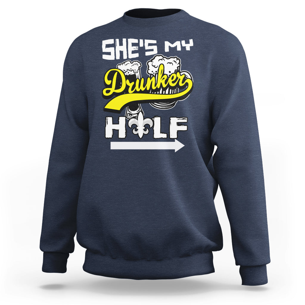 Navy sweatshirt with “She's My Drunker” and illustrated fleur-de-lis text graphic