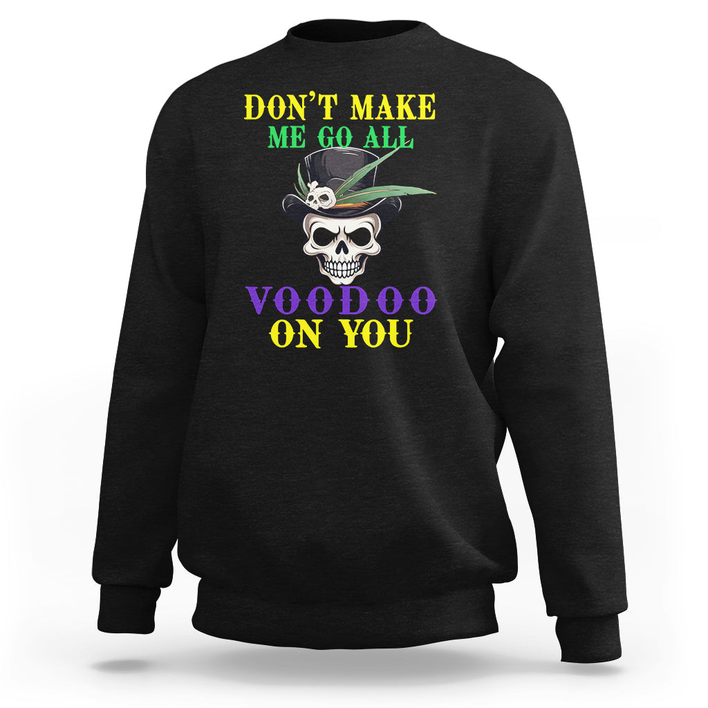 Black crewneck sweatshirt with skull graphic and colorful text “VOODOO ON YOU”