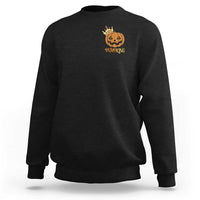 Black crewneck sweatshirt with small pumpkin graphic on chest