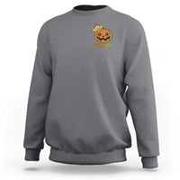 Charcoal crewneck sweatshirt with small pumpkin graphic on chest