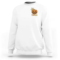 White crewneck sweatshirt with small pumpkin graphic on chest