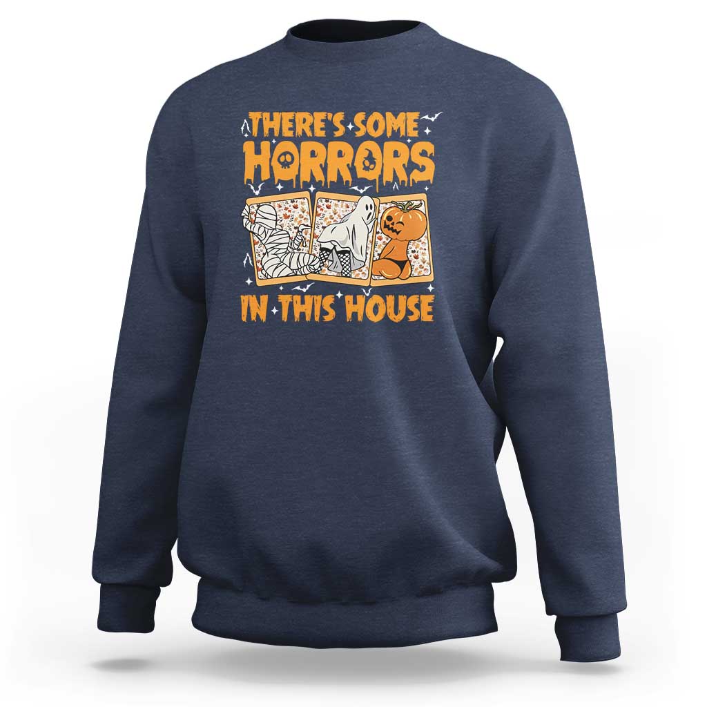 Funny Halloween sweatshirt in navy, with “There’s Some Horrors In This House” graphic.