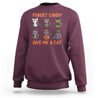 Maroon crewneck sweatshirt with cat graphic: "Forget Candy, Give Me a Cat"