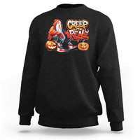 Black crewneck sweatshirt with colorful ghost and jack-o'-lantern graphic on chest