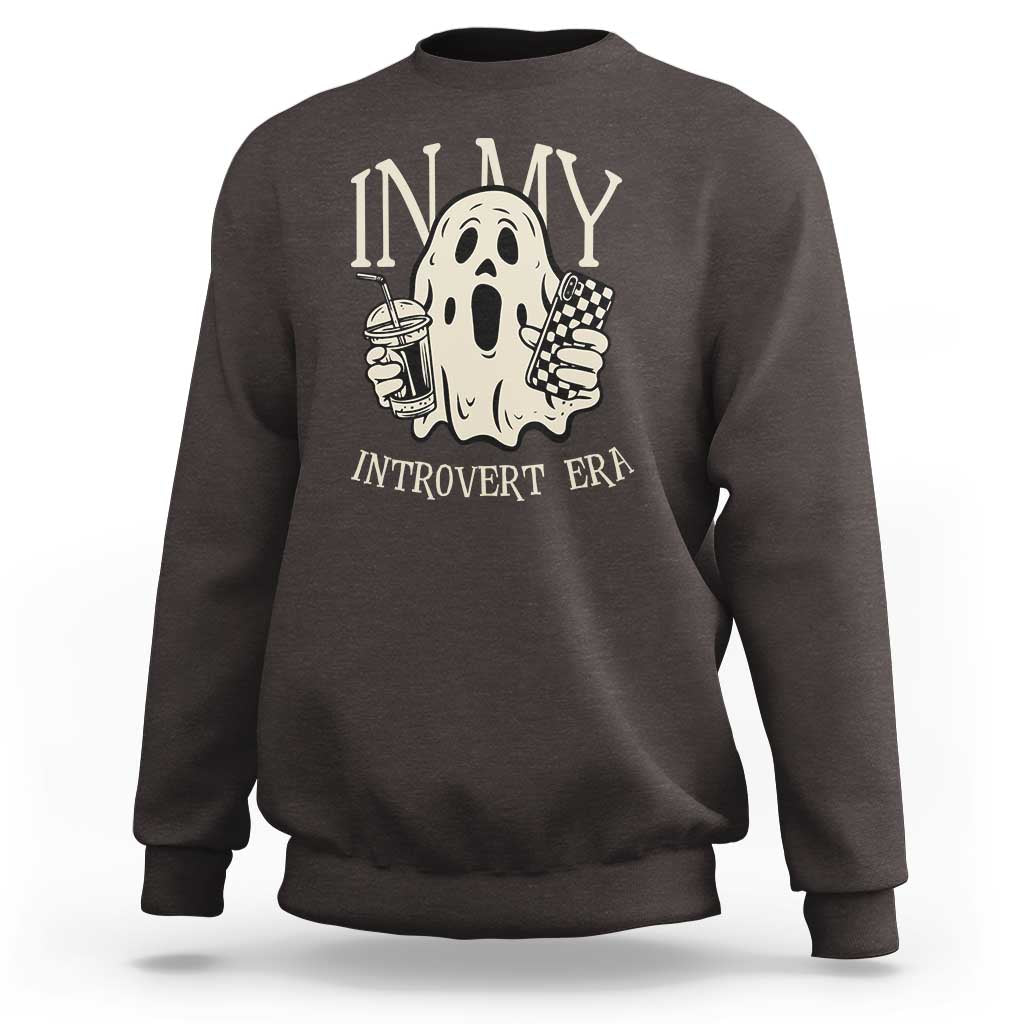 Dark gray crewneck sweatshirt with ghost back graphic and 'IN MY INTROVERT ERA' text.