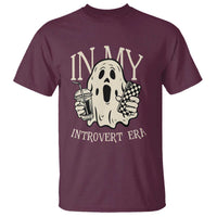 Maroon Halloween T-shirt with cartoon ghost holding drink and game controller, "Introvert Era"