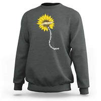 Dark chocolate sweatshirt with yellow sunflower graphic and motivational vertical text on back