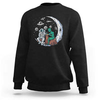 Black sweatshirt with space-themed alien astronaut graphic on the front
