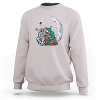 Light gray sweatshirt with space-themed alien astronaut graphic on the front