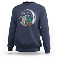 Navy sweatshirt with space-themed alien astronaut graphic on the front