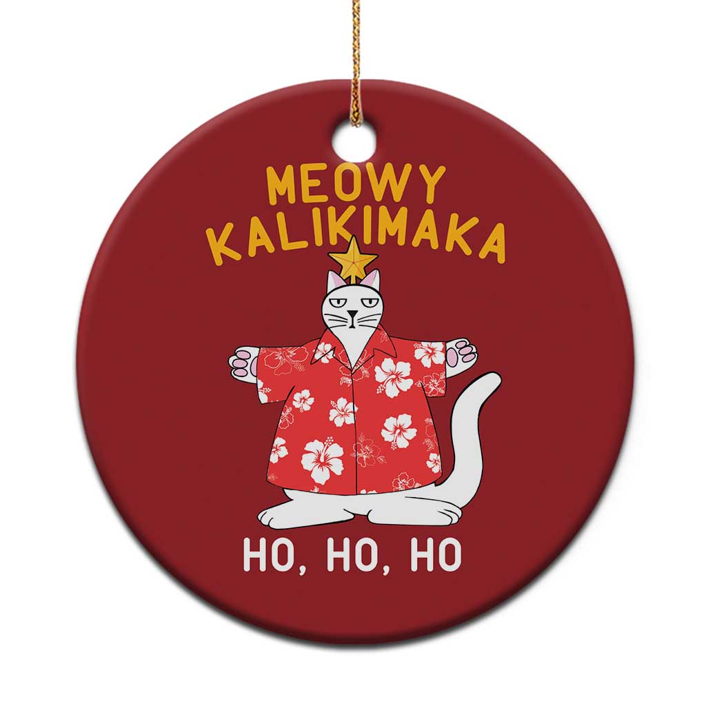 Red round cat Christmas ornament with gold string, 'MEOWY KALIKIMAKA' and 'HO HO HO' text.