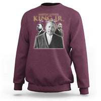 Maroon sweatshirt with Martin Luther King portrait graphic and "Be the Man" text