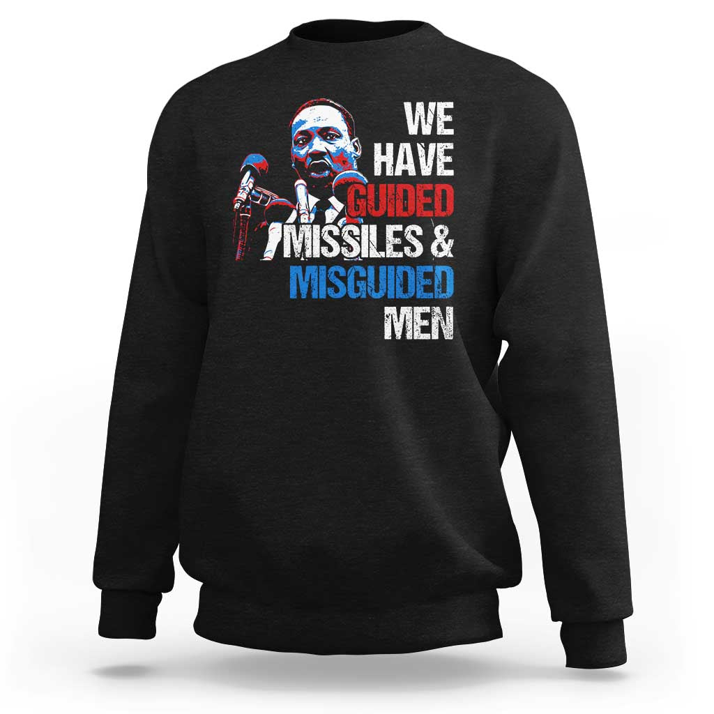 Black crewneck sweatshirt with large front graphic text: “WE HAVE GUIDED MISSILES & MISGUIDED MEN”.