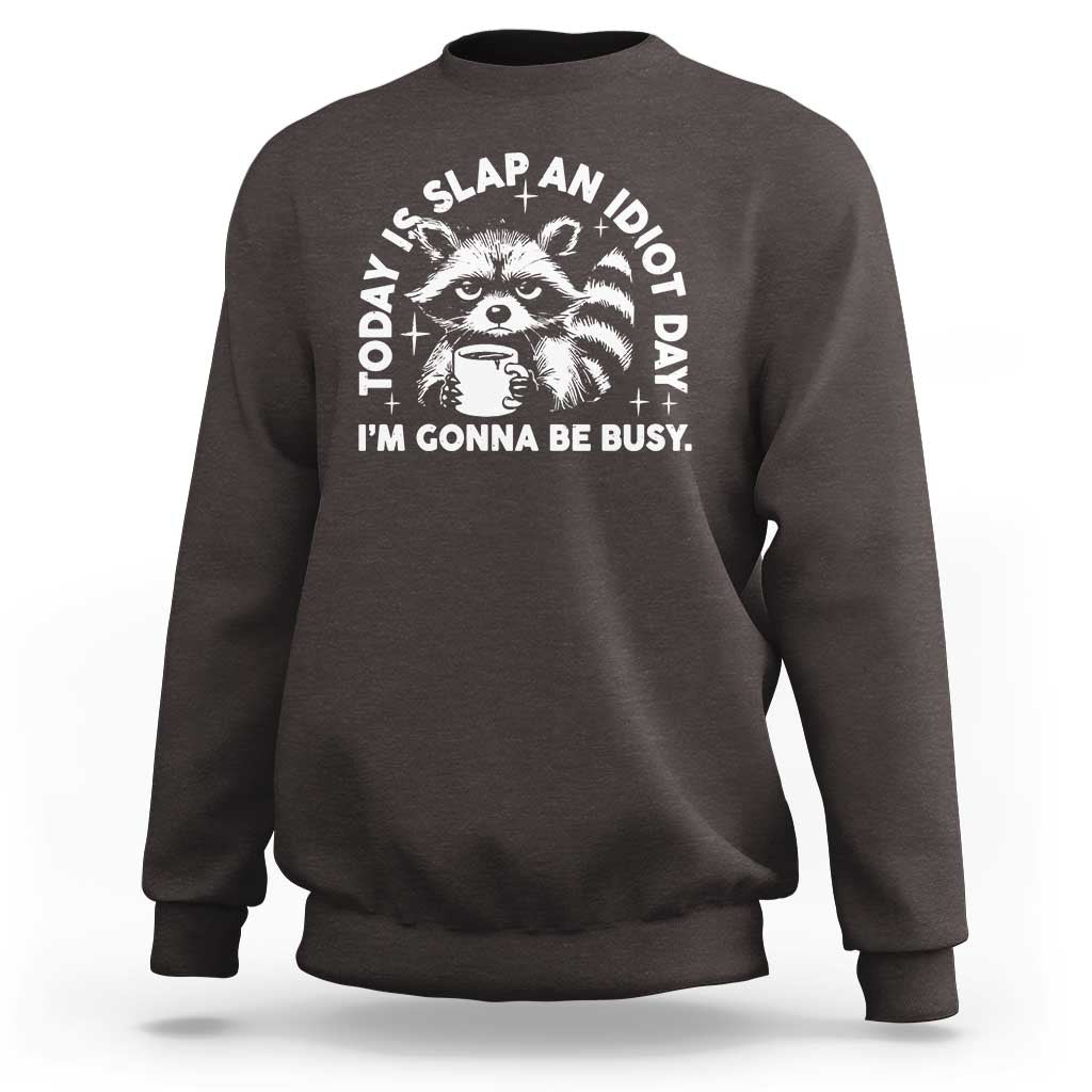 Dark chocolate raccoon graphic sweatshirt with bold text design and crew neck