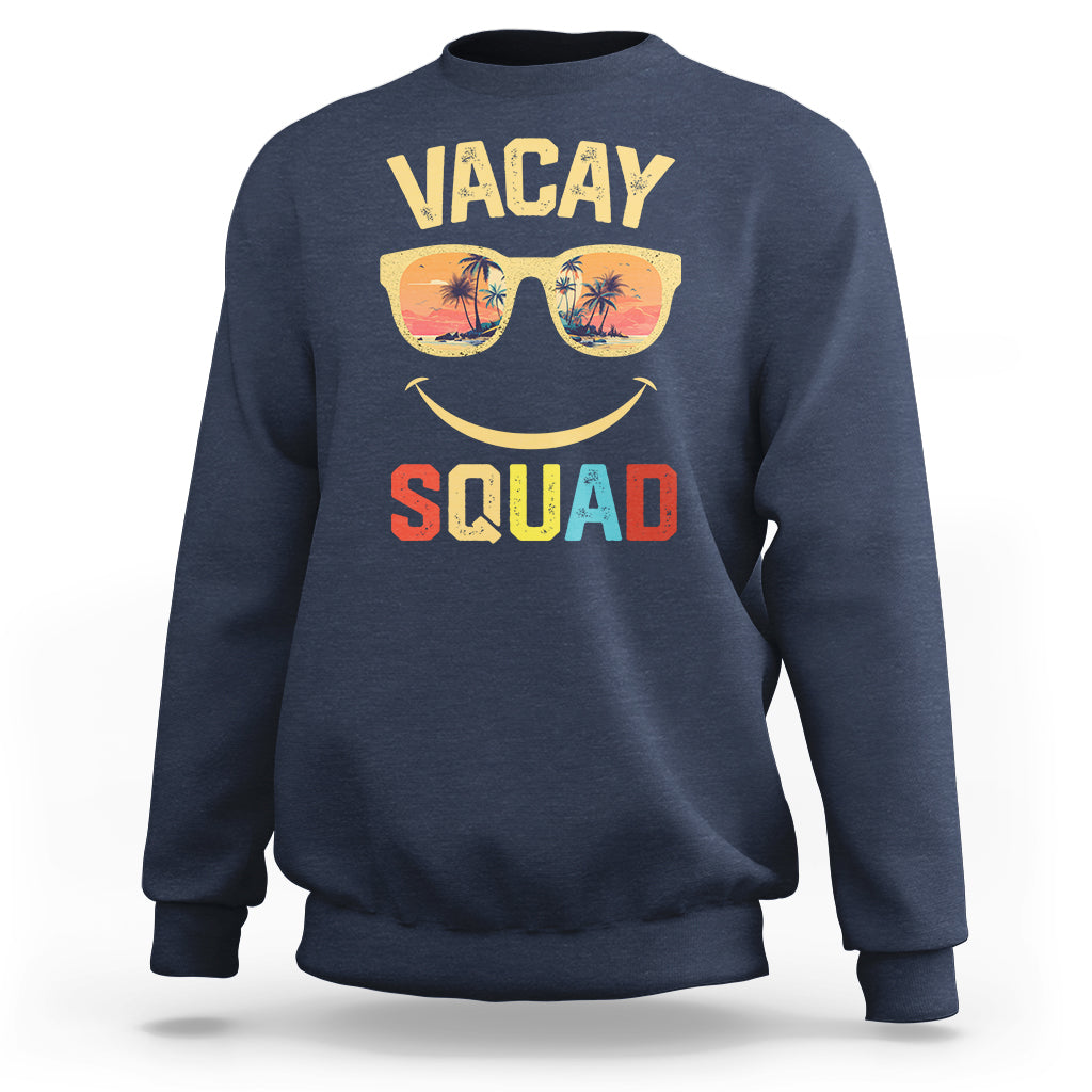 Navy crewneck sweatshirt with front graphic "VACAY SQUAD" and sunglasses smile.