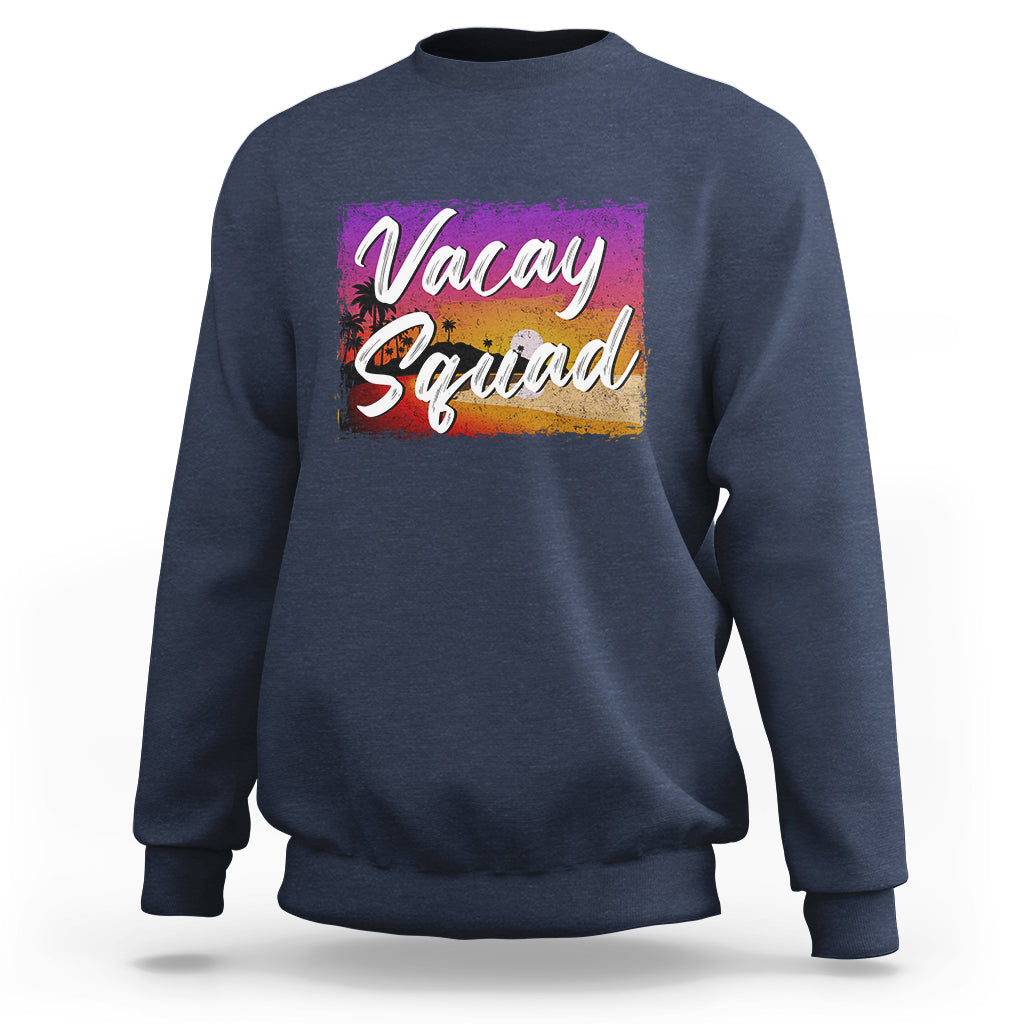 Navy crewneck sweatshirt with 'Vacay Squad' colorful beach graphic on chest.