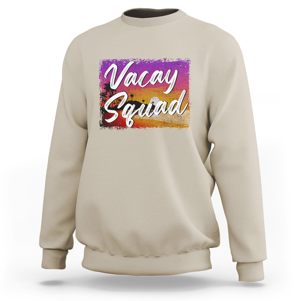 Sand crewneck sweatshirt with 'Vacay Squad' colorful beach graphic on chest.