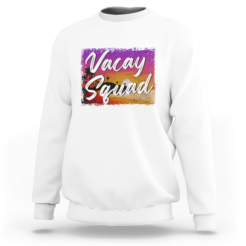 White crewneck sweatshirt with 'Vacay Squad' colorful beach graphic on chest.