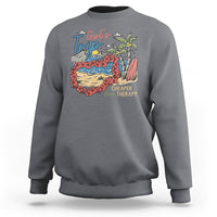 Charcoal girls' trip sweatshirt with colorful beach graphic on the front