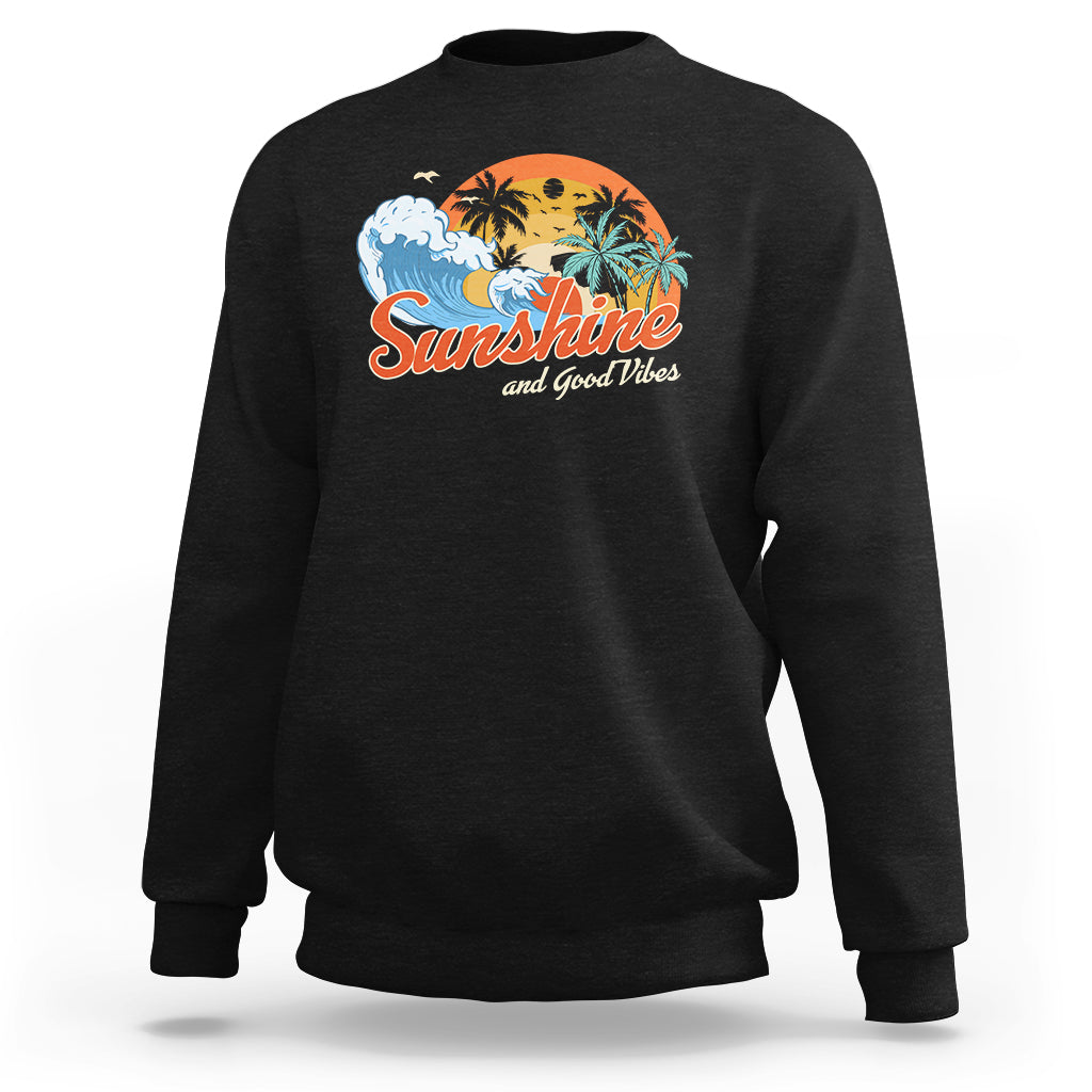 Black sweatshirt with front "Sunshine" beach graphic, crew neck, long sleeves.