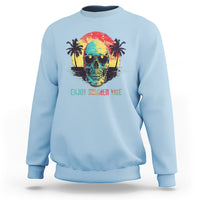 Light blue crewneck sweatshirt with colorful skull and sunglasses; “Enjoy Summer Vibe” tropical graphic