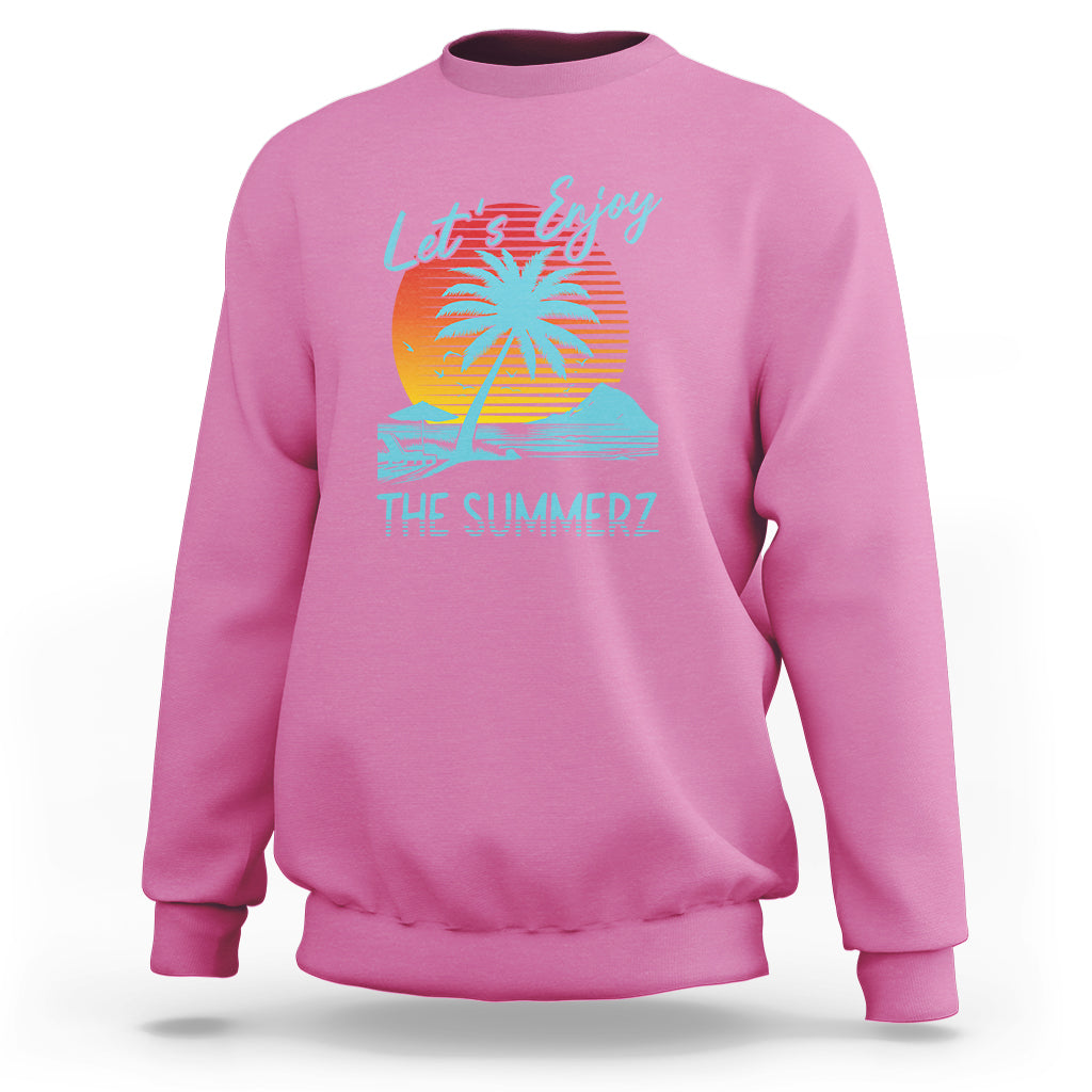 Pink crewneck sweatshirt with 'Let's Enjoy' beach sunset graphic on back