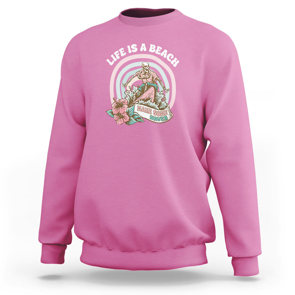 Azalea pink sweatshirt with round beach graphic on the chest, crew neck and long sleeves