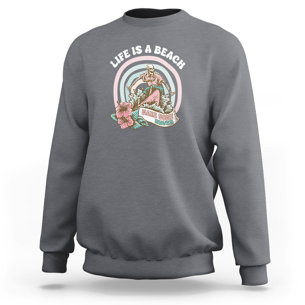 Charcoal gray sweatshirt with round beach graphic on the chest, crew neck and long sleeves