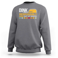 Gray pickleball sweatshirt with “DINK RESPONSIBLY” graphic, long sleeves