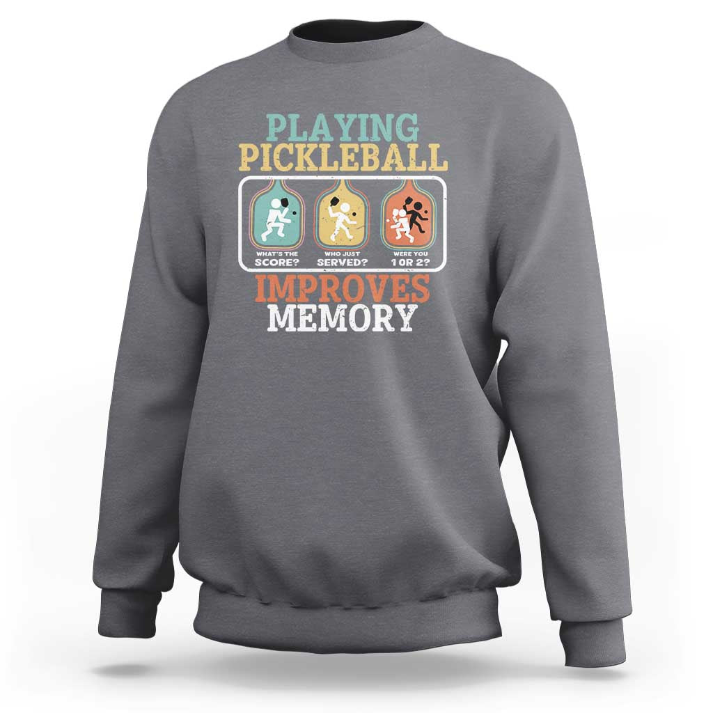 Gray crewneck sweatshirt with “Playing Pickleball Improves Memory” back graphic.