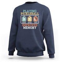 Navy crewneck sweatshirt with “Playing Pickleball Improves Memory” back graphic.