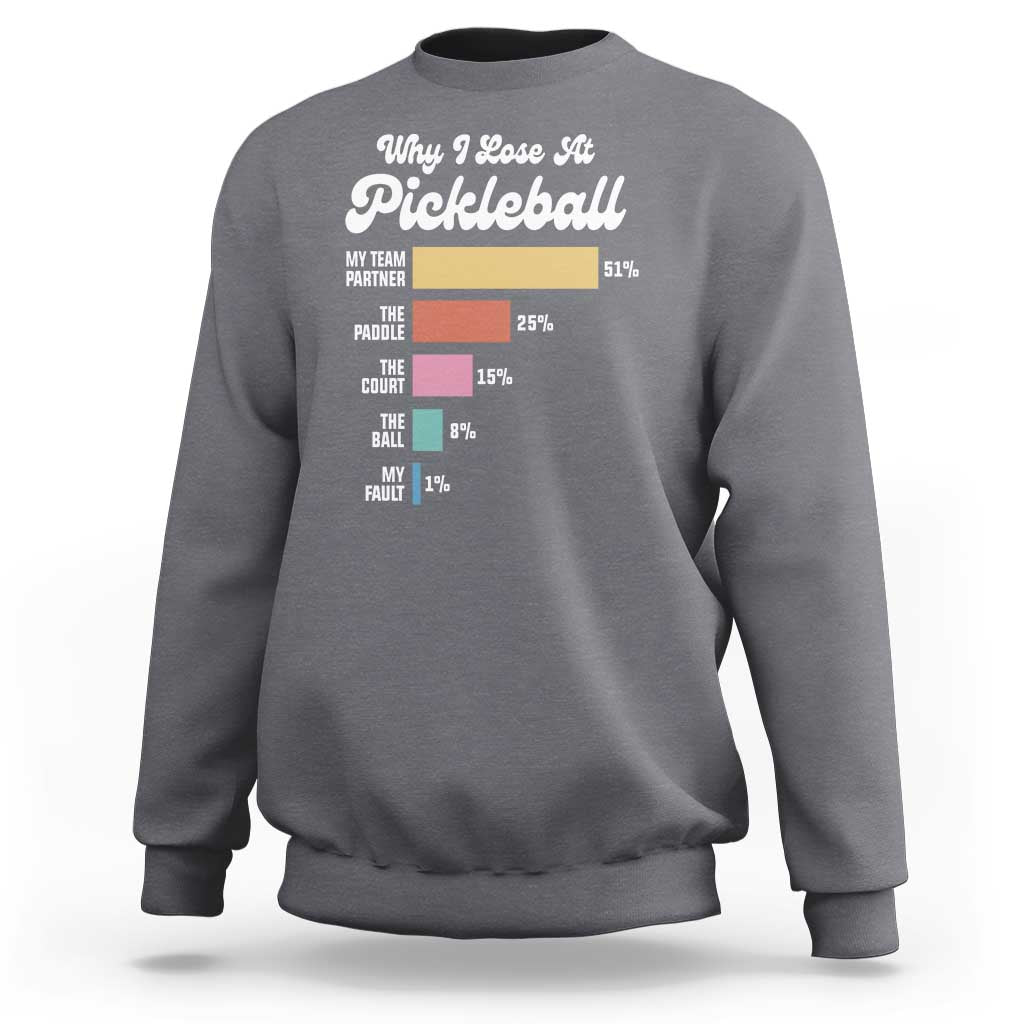 Charcoal gray crewneck sweatshirt with “Why I Lose At Pickleball” graphic on front.
