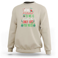 Beige sand Christmas sweatshirt with colorful gift message graphic on front