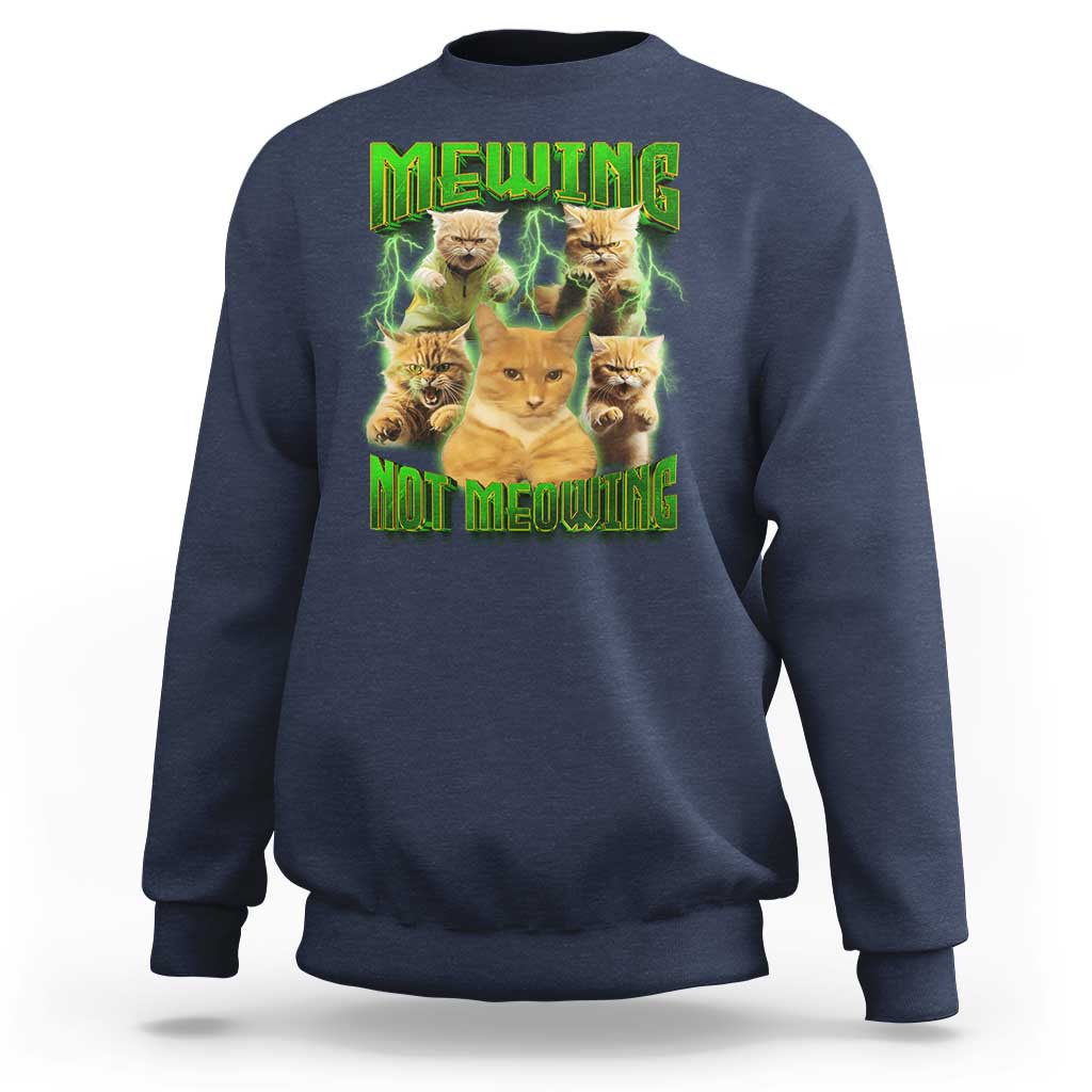 Navy sweatshirt with cat meme graphic reading 'MEWING NOT MEOWING' in neon green