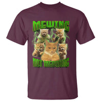 Maroon cat meme graphic T-shirt with glowing cats and text “MEWING” / “NOT MEOWING”