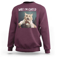 Maroon crewneck sweatshirt with cat graphic and "WAIT I'M GOATED" text