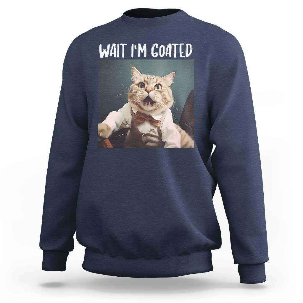 Navy crewneck sweatshirt with cat graphic and "WAIT I'M GOATED" text