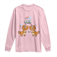 Light pink long-sleeve T-shirt with dinosaur and unicorn graphic on the front