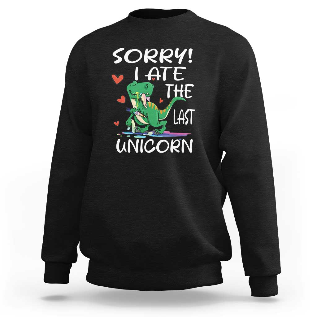 Black sweatshirt with green dinosaur graphic and 'SORRY! EAT THE LAST UNICORN' text