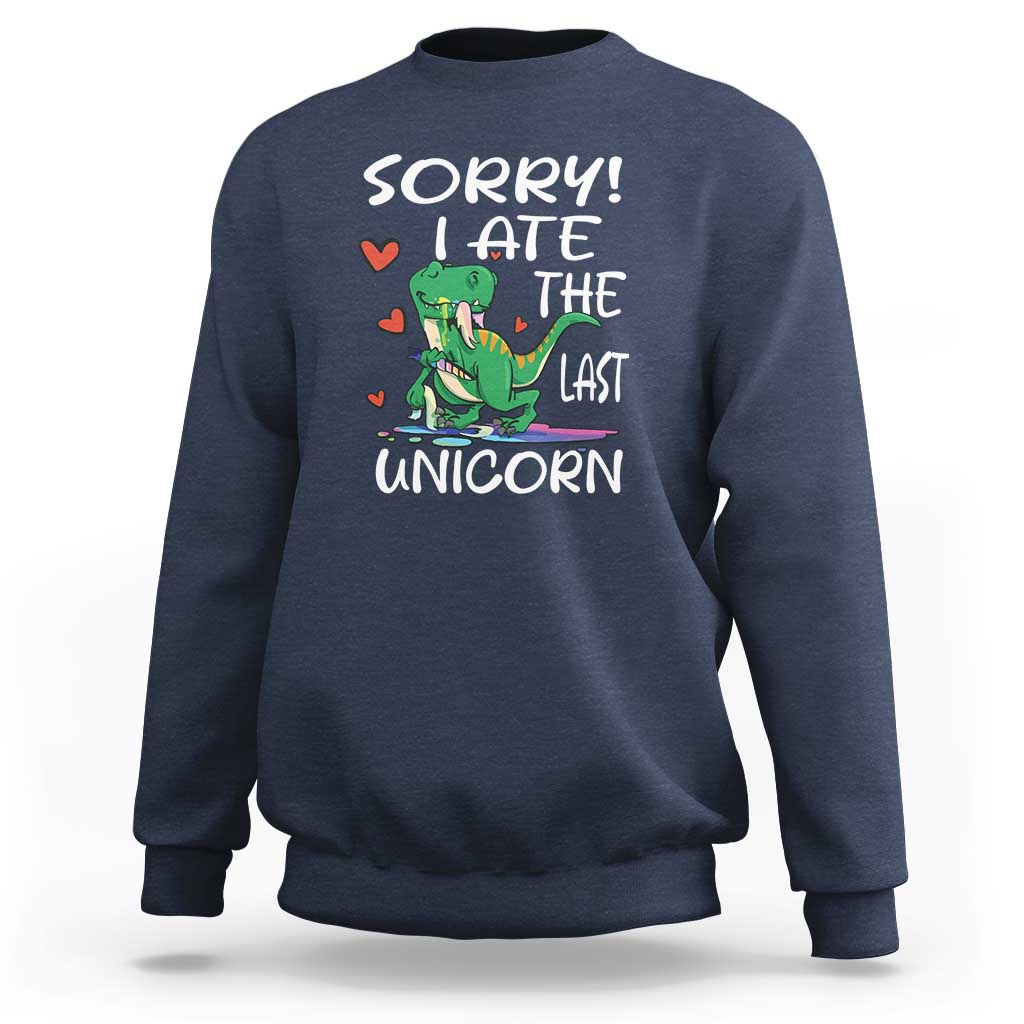 Navy sweatshirt with green dinosaur graphic and 'SORRY! EAT THE LAST UNICORN' text