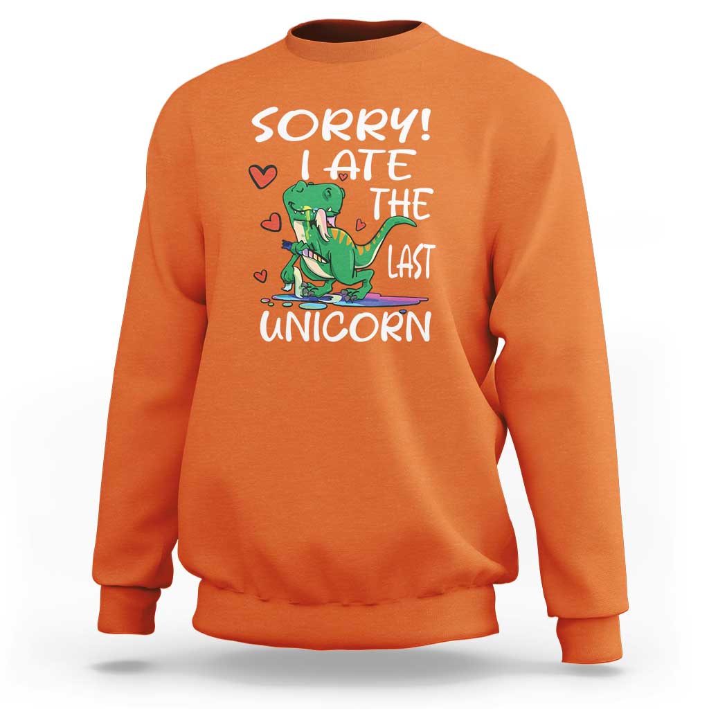 Orange sweatshirt with green dinosaur graphic and 'SORRY! EAT THE LAST UNICORN' text